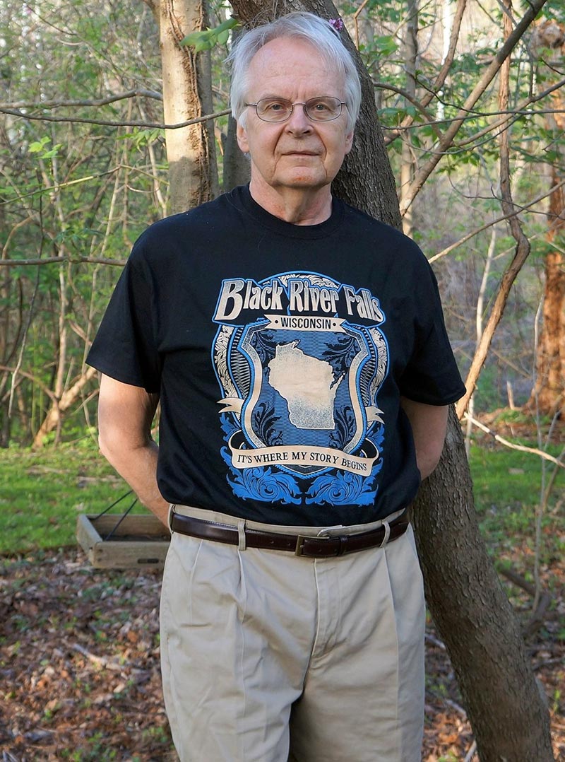photo of author Daniel Luther Olson leaning up against a tree